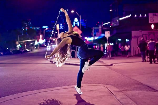 Dancer mid-move under warm light